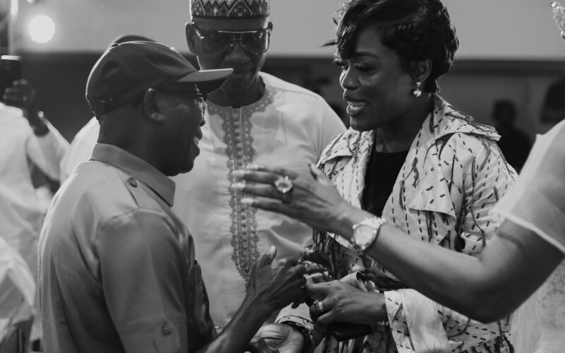 Dr. Adaeze Oreh in conversation with dignitaries (black and white)
