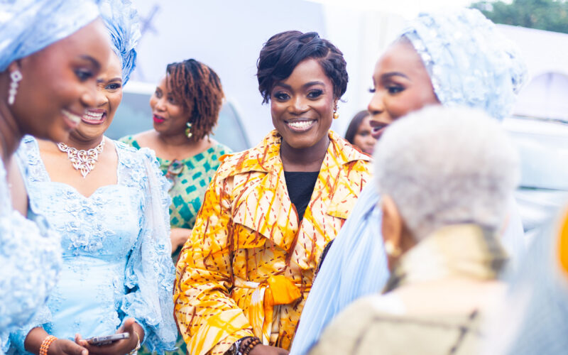 Dr. Adaeze Oreh greeting fellow guests at a formal ceremony