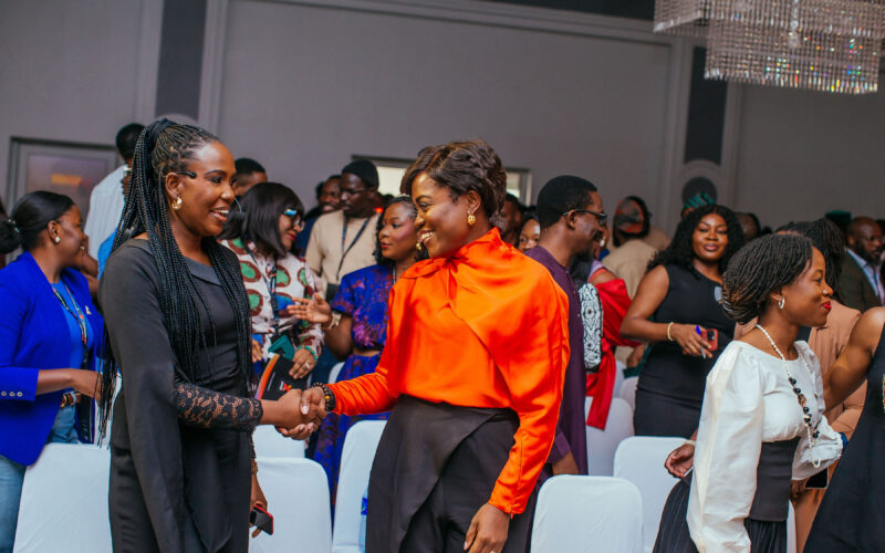 Dr. Adaeze Oreh greeting colleagues at a professional engagement